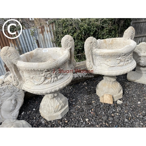 490H - A pair of large concrete fleur de lys style pedestal planters