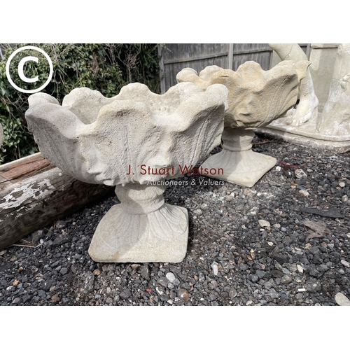 490I - A pair of concrete pedestal urns