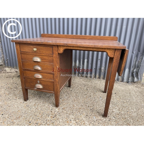 12 - A 20th century oak kneehole desk