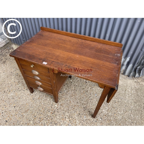 12 - A 20th century oak kneehole desk