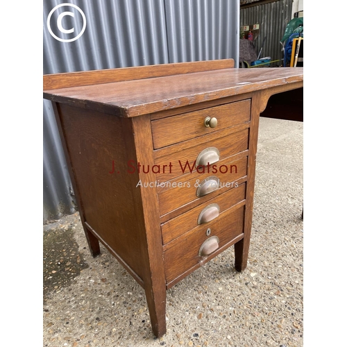 12 - A 20th century oak kneehole desk