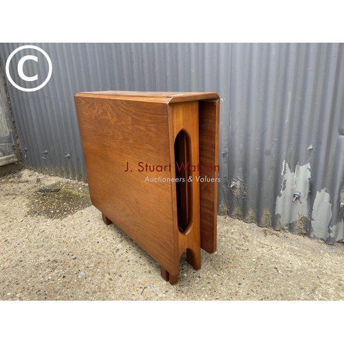 2 - A teak drop leaf kitchen table