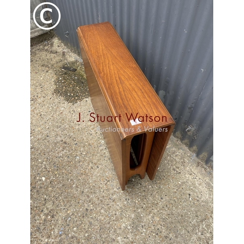 2 - A teak drop leaf kitchen table