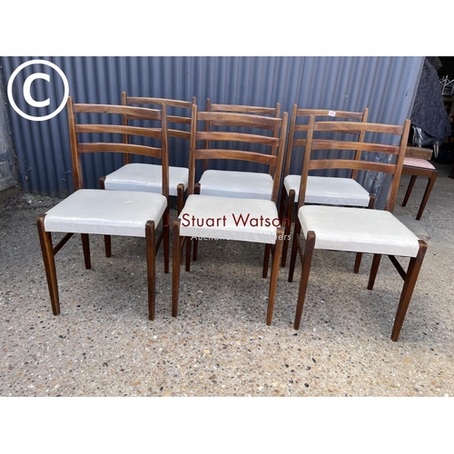 242 - A set of six teak dining chairs with white seats (possibly danish)