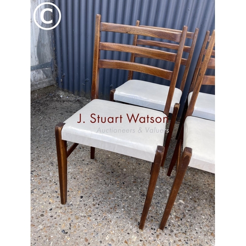 242 - A set of six teak dining chairs with white seats (possibly danish)