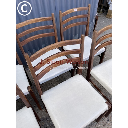 242 - A set of six teak dining chairs with white seats (possibly danish)