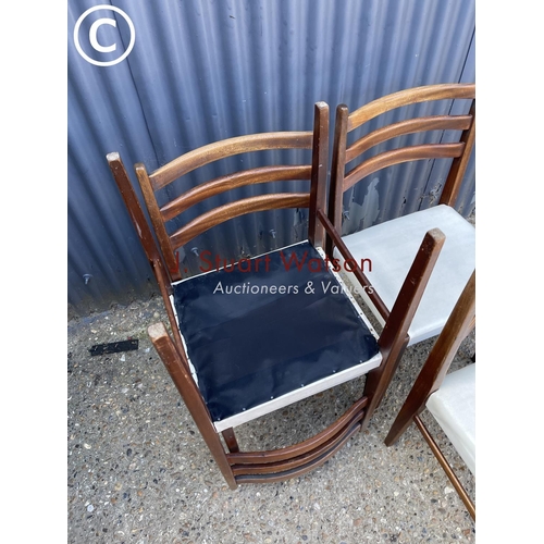 242 - A set of six teak dining chairs with white seats (possibly danish)