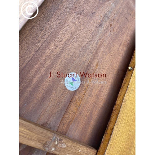 243 - A Macintosh teak circular extending dining table