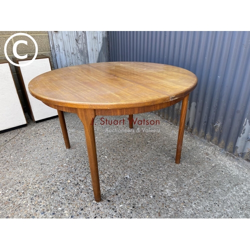 243 - A Macintosh teak circular extending dining table