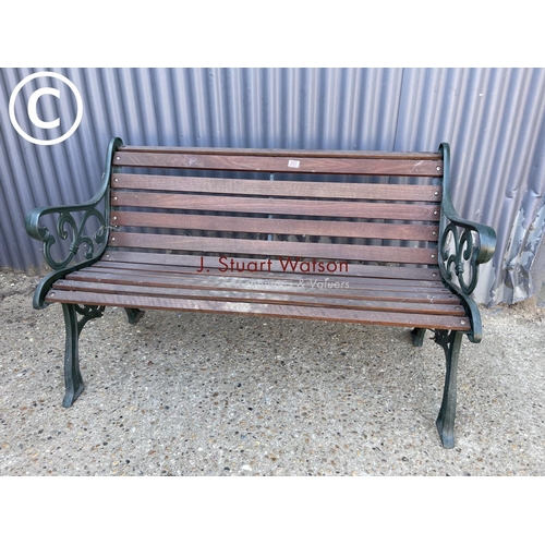 251 - A good quality iron framed garden bench with hardwood seat
