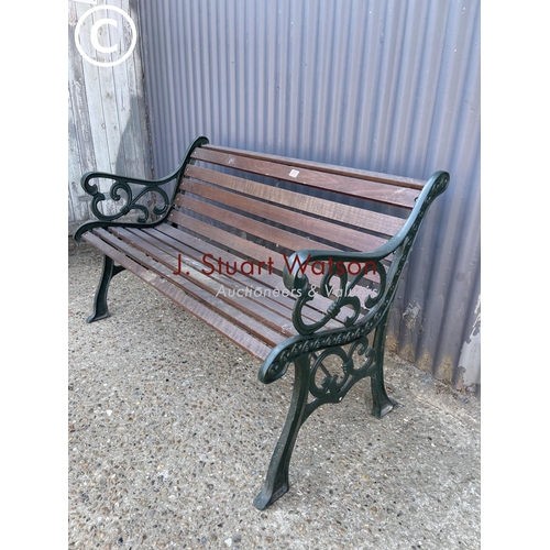 251 - A good quality iron framed garden bench with hardwood seat