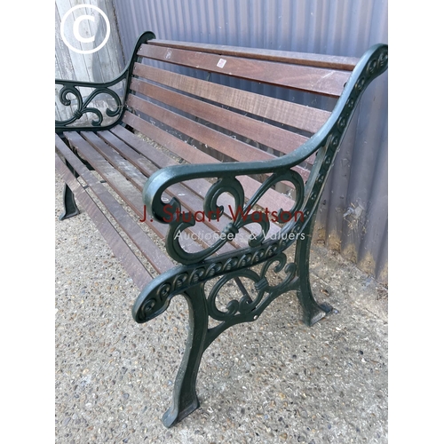 251 - A good quality iron framed garden bench with hardwood seat