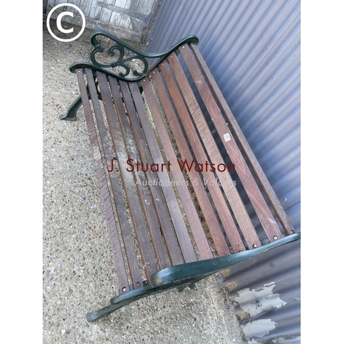 251 - A good quality iron framed garden bench with hardwood seat