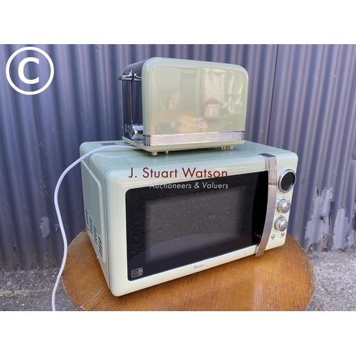 257 - Matching swan microwave and toaster