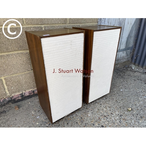 259 - A pair of teak cased stereo speakers