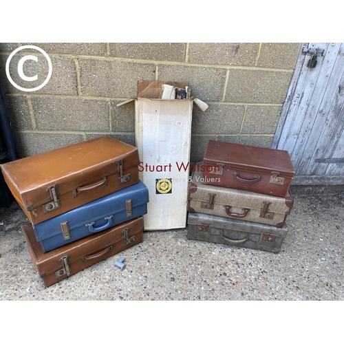 279 - Six vintage cases and a folding camp bed