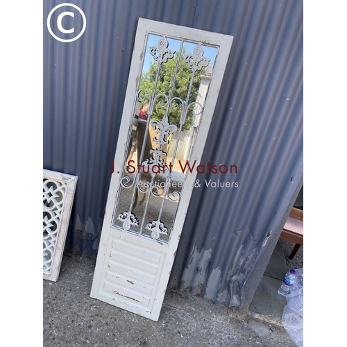 283 - A tall rectangular white painted garden mirror