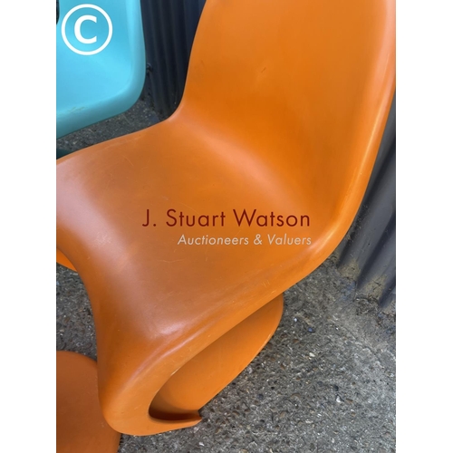 288 - A set of four Verner Panton designer chairs, two orange two blue