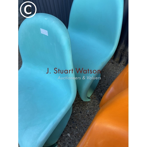 288 - A set of four Verner Panton designer chairs, two orange two blue