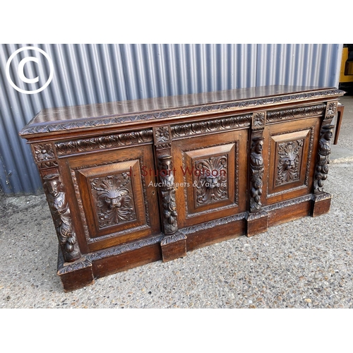 299 - A carved oak three door sideboard 150 x50x70