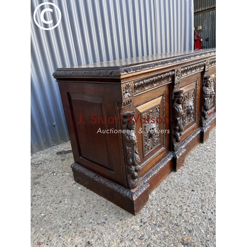 299 - A carved oak three door sideboard 150 x50x70
