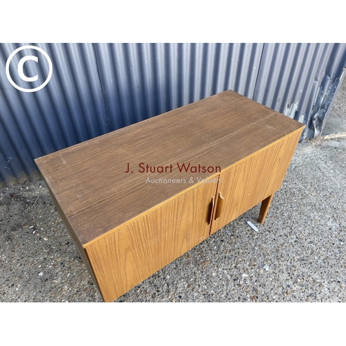 303 - A retro two door record cabinet / sideboard