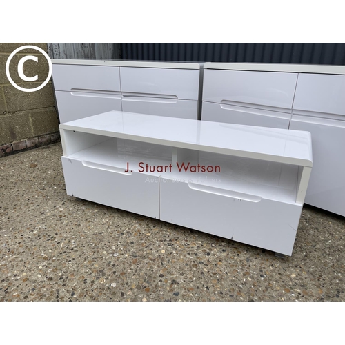 31 - A pair of white gloss sideboards together with a matching tv stand