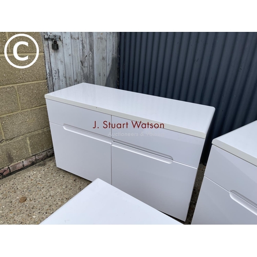 31 - A pair of white gloss sideboards together with a matching tv stand