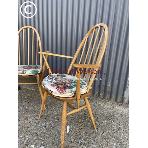 315 - A pair of mid century light elm Ercol carver chairs