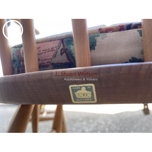 315 - A pair of mid century light elm Ercol carver chairs