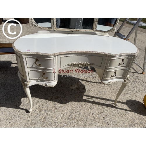 319 - A white painted  french style kidney shape dressing table
