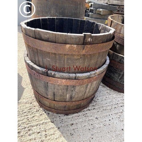 467 - A pair of half whiskey barrel planters