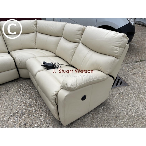 47 - A modern cream leather effect corner sofa with electric recline and foot rest function.