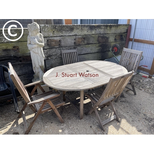 476 - A solid hardwood garden table together with two carvers and two standard  chairs