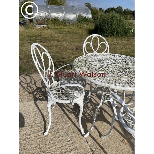 479 - White painted aluminium table and four  chairs