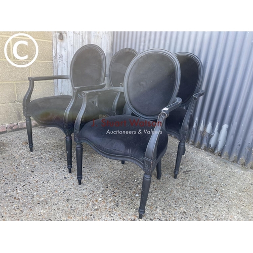 49 - A set of four black french style carver chairs