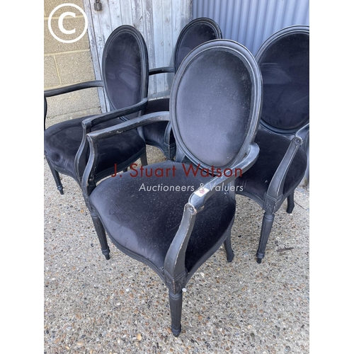 49 - A set of four black french style carver chairs