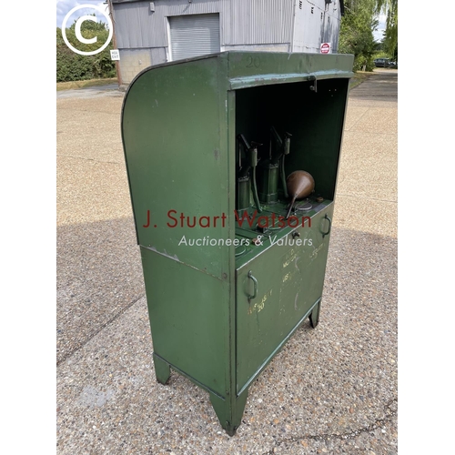 499 - A vintage green three pump oil dispensing cabinet, together with copper funnels and oil jug