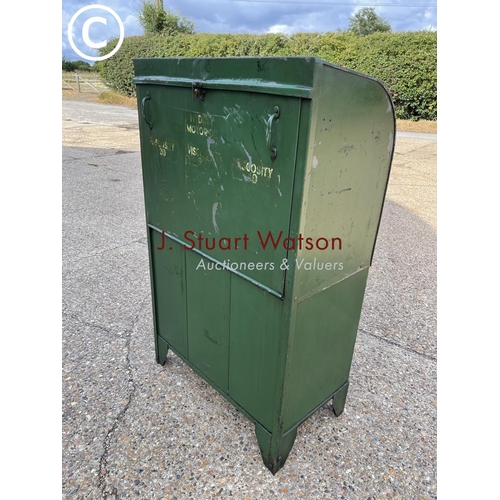 499 - A vintage green three pump oil dispensing cabinet, together with copper funnels and oil jug