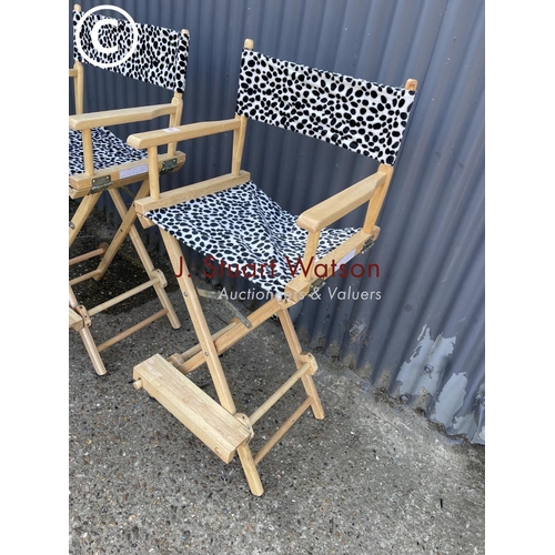 50 - A pair of spotted high folding directors chairs