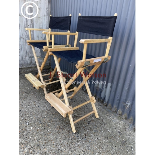 51 - A pair of black high folding directors chairs