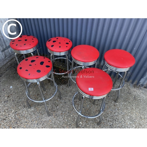 54 - A set of six chrome stools with red vinyl seats