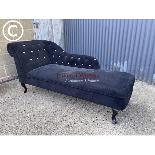 55 - A black chaise lounge settee with diamanté studs (one missing)