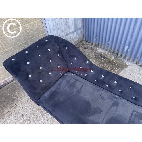 55 - A black chaise lounge settee with diamanté studs (one missing)