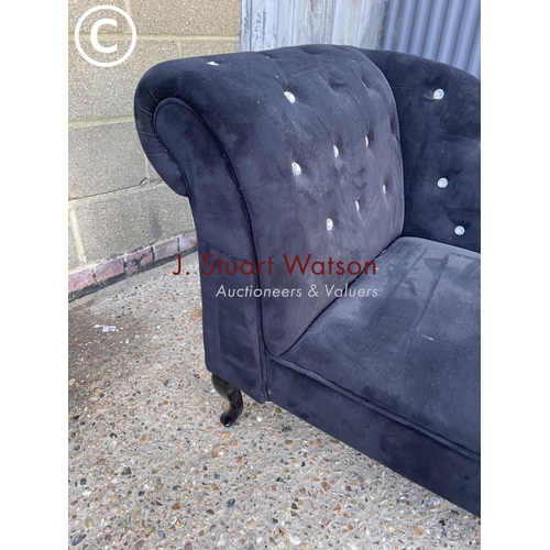 55 - A black chaise lounge settee with diamanté studs (one missing)