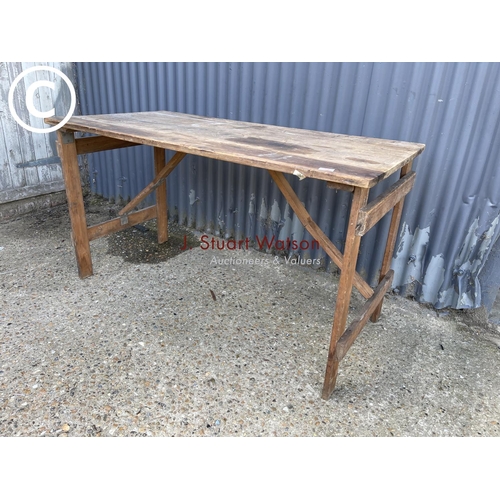 59 - A vintage folding trestle table