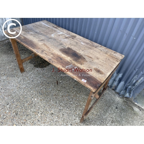 59 - A vintage folding trestle table