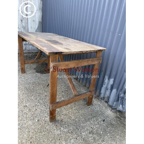 59 - A vintage folding trestle table