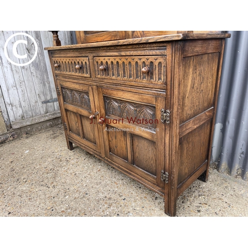 6 - A carved oak court cupboard sideboard