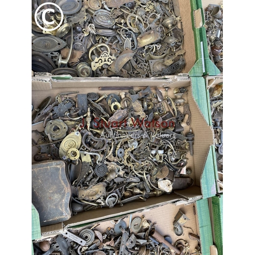 60 - Nine trays of antique brass and iron furniture handles, castors and other fittings